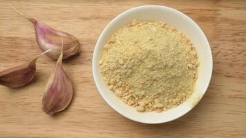 The natural spice is dried ground garlic and garlic cloves. Seasoning for cooking dishes and marinades. Fragrant spice video
