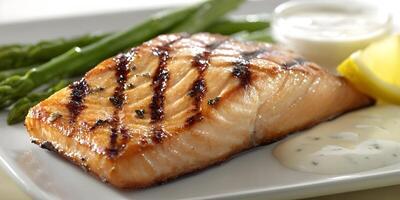 Grilled Salmon Fillet with Asparagus and Lemon Sauce photo