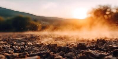 Sunset Dust Particles Over Cracked Dry Ground Soil Texture photo