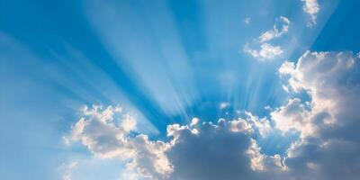 Bright Sunbeams Breaking Through Clouds Blue Sky Background photo
