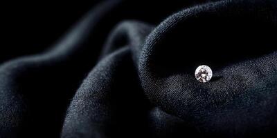 Single Diamond on Black Fabric Luxury Gemstone Image photo