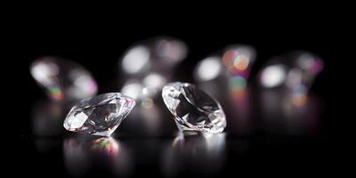 Brilliant Diamonds on Black Background Closeup Photography Sparkle Gems photo