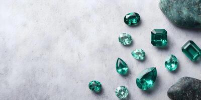 Various Emerald Gemstones on Gray Surface with Green Stones photo
