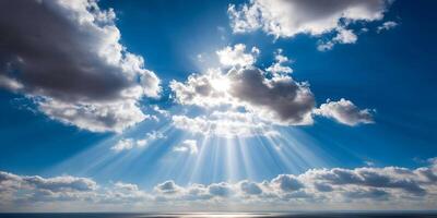 Bright Sunbeams Shining Through Clouds over Calm Sea Sky Scene photo
