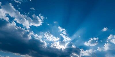 Sunbeams Breaking Through Cumulus Clouds Blue Sky photo