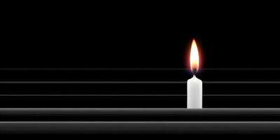 Single Lit Candle on Black Background with Horizontal Lines photo