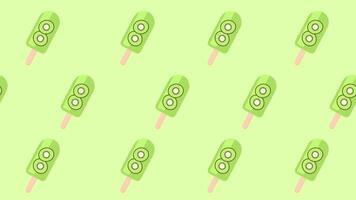Multiple kiwi popsicles on a green background arranged in a repeating pattern representing refreshing tropical sweetness and design harmony video