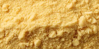Crumbly Yellow Crumbs Texture Background Close Up photo