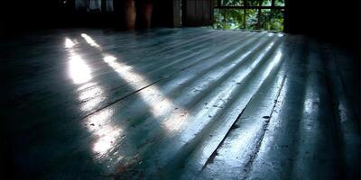Sunlight Through Window on Old Green Wooden Floor photo