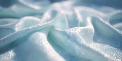 Light Blue Sparkling Fabric Texture Shiny Shimmery Cloth Background Elegant Draped Material Close Up photo