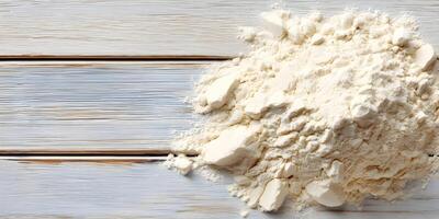 Pile of Wheat Flour on White Wooden Background Baking Ingredient Food Photography photo