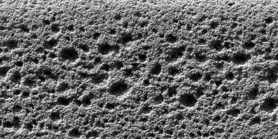Abstract Gray Bubbly Texture Background Grey Granular Surface Closeup Detailed Microstructure Seamless Pattern photo