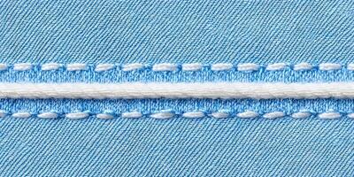 Blue Denim Fabric Texture with White Stitching and Cord photo