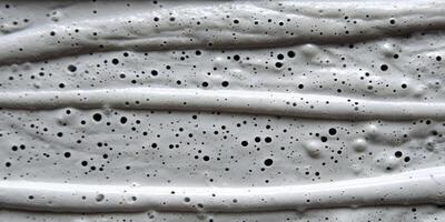 Gray Textured Paint Swirl with Air Bubbles Close Up Detailed Surface photo