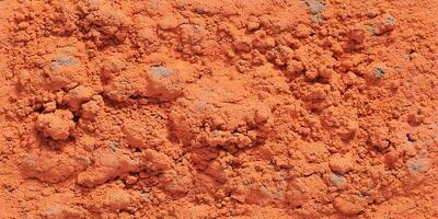 Orange Textured Surface Background Reddish Brown Granular Material Close Up photo