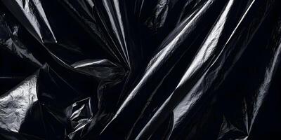 Black Plastic Bag Texture Crumpled Creases Dark Background photo