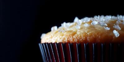 Closeup of Salted Caramel Cupcake in Dark Setting photo