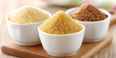 Three Bowls of Different Types of Sugar Granulated Brown Light Brown Sweetener photo