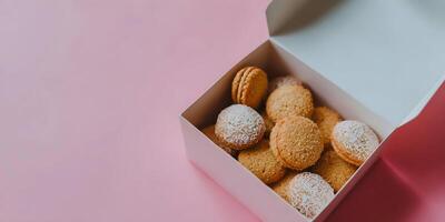 Sweet Macarons and Cookies in White Gift Box on Pink Background photo