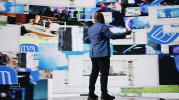 African American public speaker on stage surrounded by digital visuals, symbolizing a global conference where trends, mobile apps and AI powered content dominate modern communication. Camera A. video
