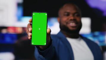 African American expert showing copy space display next to digital interfaces and multimedia visuals, showcasing content creation, mobile technology and global online influence. Camera B. video