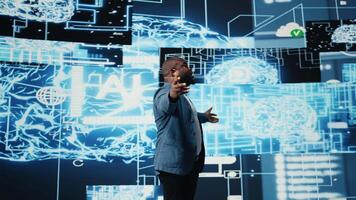 African american tech expert presenter speaking about AI at modern event, hosting a convention to offer insight on machine learning neural networks systems for the live audience. Camera A. video