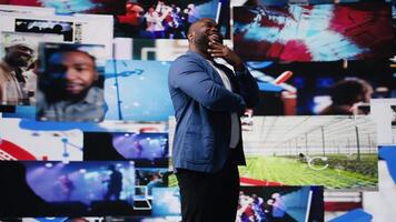 Tech savvy individual engaging with multimedia dashboards displays, showcasing power of AI, technology and digital content. Showcasing mobile apps, followers and internet communication. Camera A. video
