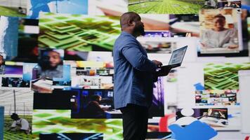 High tech black user connecting on web platforms with vibrant digital interfaces and data visualizations, showcasing mobile networking engagement. Social media web experience. Camera A. video