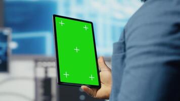 Black tech savvy programmer uses chroma key screen from innovation hub, working on digital transformation with software engineering and data science. Cybersecurity and automation. Camera B. video