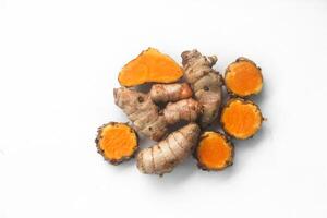 Tubers of the Curcuma zanthorrhiza or temulawak plant arranged on a white background photo