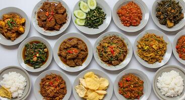 Variety of Delicious Dishes on Plates Arranged with Rice and Chips photo