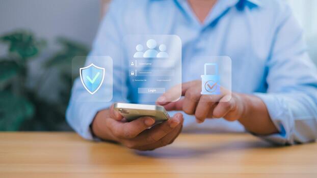 Person holding a smartphone interacts with a transparent overlay showing a login screen with security icons shield, padlock, user profiles. Online security, data protection, and user authentication. photo