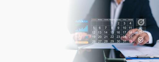 Person interacting with a digital calendar overlay, planning business tasks with icons for growth, gears, targets, and checkmarks, Efficient scheduling, strategic project management, goal achievement. photo