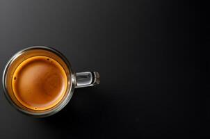 An espresso cup with a dark background photo