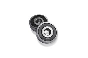 Two shiny metal bearings isolated on a white background include clipping path photo