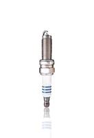 Iridium Spark Plug, A single, new iridium spark plug with a white ceramic insulator and metal threading, isolated on white background include clipping path. photo