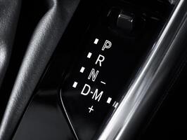 Closeup of car gear selector, automatic transmission display. Shifter, P R N D M modes. photo
