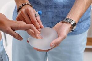 Surgeon and Patient Discuss Breast Implant Before Mammoplasty Augmentation and Shape Correction photo