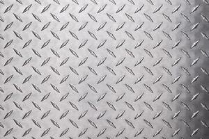 texture stainless steel with diamond pattern. light metal floor or wall background photo