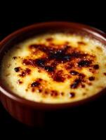 Close up of Creme brulee in a ramekin, caramelized sugar topping. photo