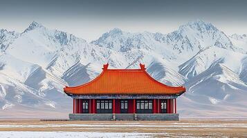 Traditional Asian temple nestled against snow-covered mountains. This image captures a striking contrast between architectural heritage and the raw beauty of winter landscapes. photo