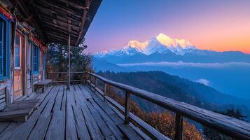 Serene mountain view from a rustic wooden balcony at dawn. photo