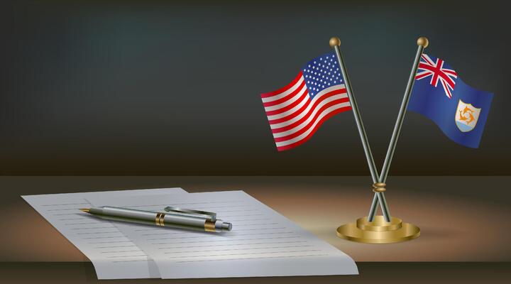 USA and Anguilla flags on table in office. International relations on a dark gradient color background.