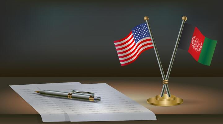 USA and Afghanistan flags on table in office. International relations on a dark gradient color background.