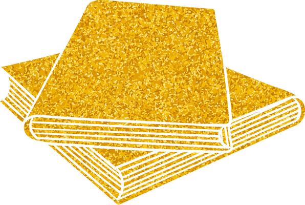 Golden sparkly books stacked on a surface