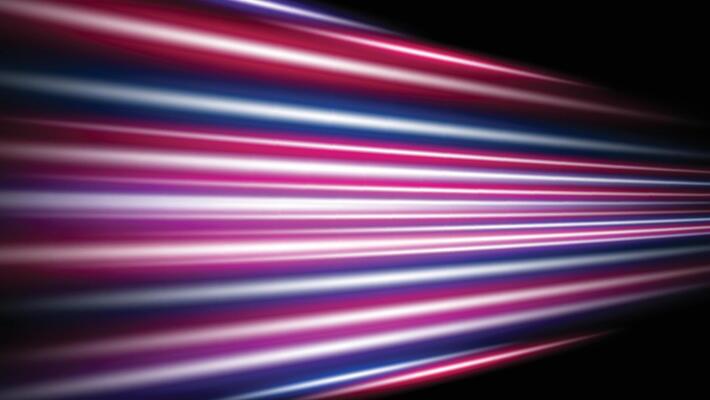 light trails on dark background. futuristic speed lines with colorful light glowing effect