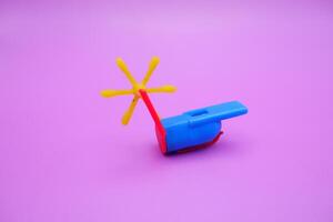 Vintage-Inspired Whistle Toy on Vibrant Background photo