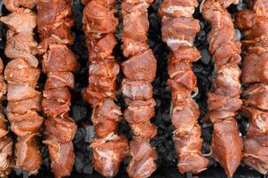 A grill with many different types of meat on it photo