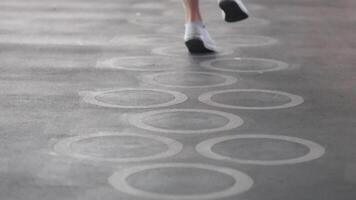 Sequential frames of a person jumping over designs video