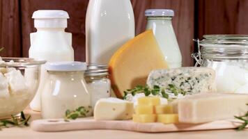 Assorted dairy items arranged on a wooden surface video